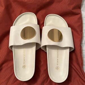 Never worn Tory Burch platform slides with gold accent